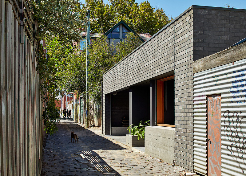 Local house promotes a sense of community by creating a rear studio which directly connects visually and physically with the lane